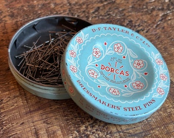Vintage pastel blue Dorcas metal dressmakers tin filled with sewing pins. Made in England. Perfect sewing box essential! Very good condition