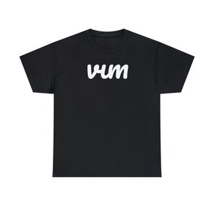 May include: Black t-shirt with the word "vum" printed in white on the front.