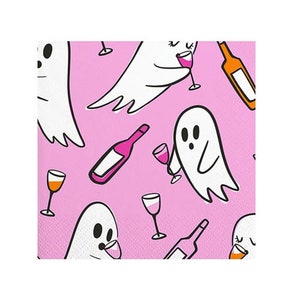 May include: Pink and white patterned paper napkins with a repeating design of ghosts drinking wine. The ghosts are white with black eyes and mouths. The wine is pink and the bottles are brown.