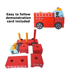 May include: A red wooden fire engine toy with a blue cab and yellow accents. The engine is made up of multiple pieces that can be assembled and disassembled. The toy includes a small figure of a firefighter in the cab.