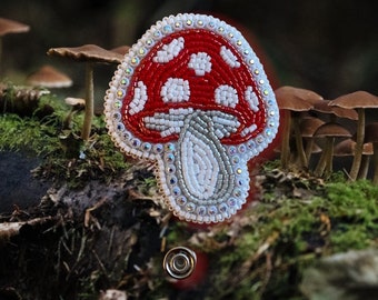 Cute button mushroom badge reel.