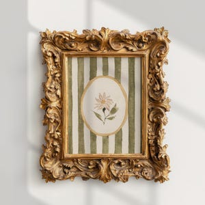 May include: A framed watercolor painting featuring a daisy. The painting is set against a backdrop of green and white vertical stripes. The ornate gold frame adds a touch of elegance to the artwork.