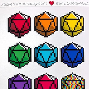 May include: A sticker sheet featuring pixelated D20 dice in various colors, including red, orange, yellow, green, blue, purple, pink, and gray. The sticker sheet has the text "StickerHuman.etsy.com" and "Item: 0040MAAA".