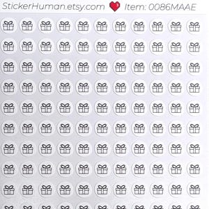 May include: Sheet of stickers featuring small, black line art gift box designs inside white circles. The stickers have a glossy finish. The text "StickerHuman.etsy.com" and "Item: 0086MAAE" are printed at the top.