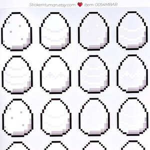 May include: A sheet of stickers featuring pixelated white eggs with black outlines. The stickers have a retro video game aesthetic. The text "StickerHuman.etsy.com" and item number "0054MBAB" are printed at the top.