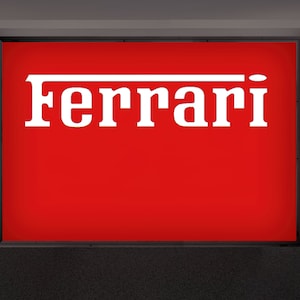 Logotipo de Ferrari en la pared con letras de aluminio*
