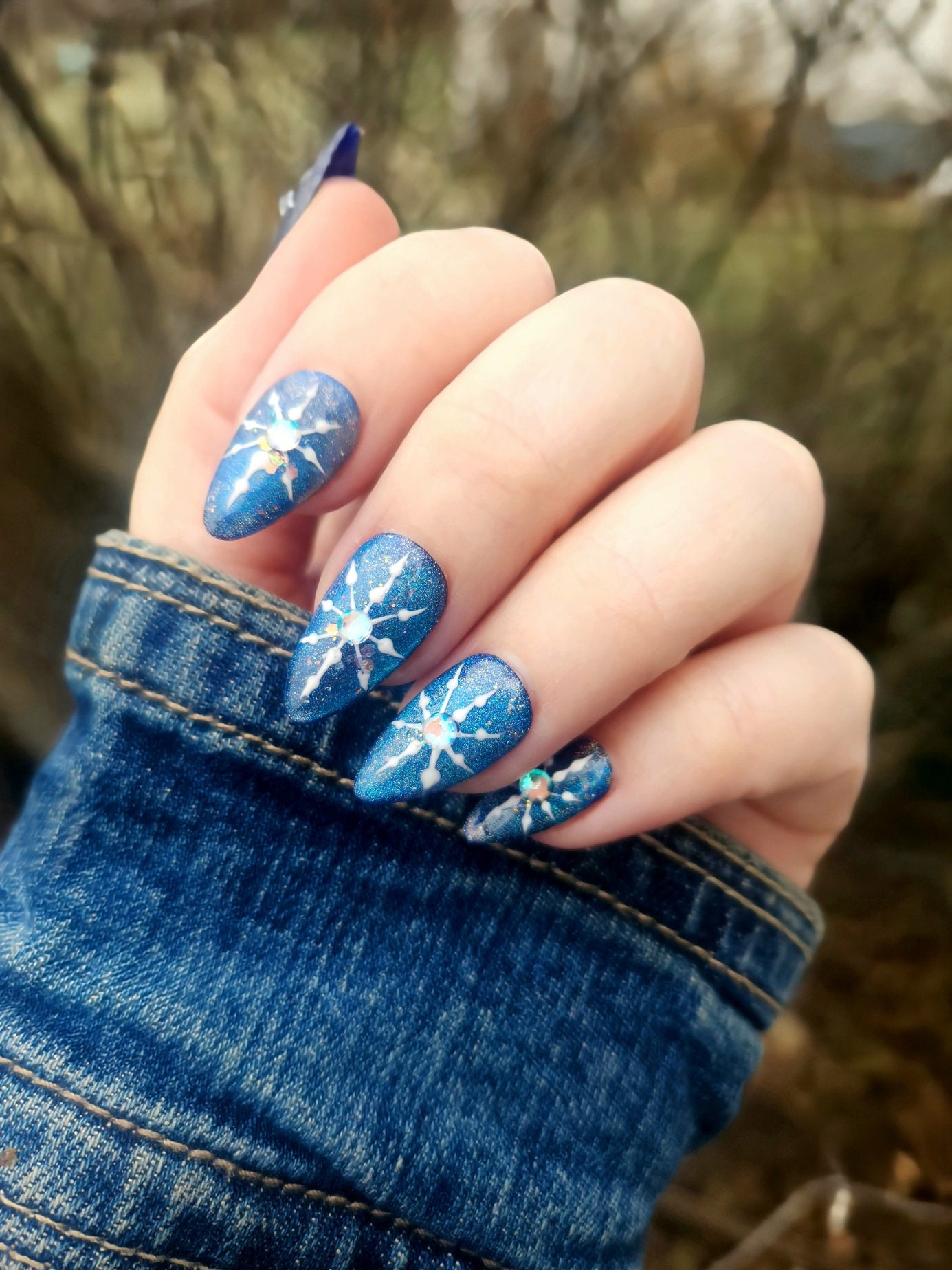 Snowflake Crystal Embossed Nails with Cat Eye Glamour