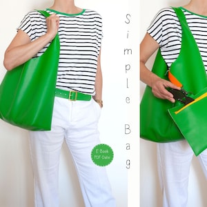 Könnte beinhalten: Eine grüne Ledertasche mit einer gelben Reißverschlusstasche. Die Tasche wird von einer Person getragen, die ein gestreiftes Hemd und eine weiße Hose trägt.