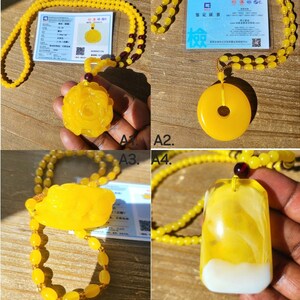 May include: Four yellow amber necklaces with different pendants. The pendants include a flower, a circle with a hole in the center, a dragon, and a rectangular shape with white swirls. Each necklace has a certificate of authenticity with Chinese text.