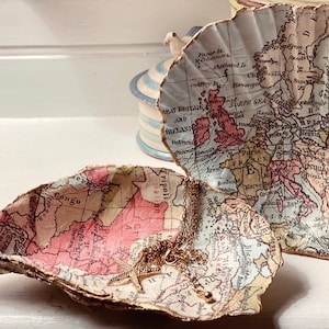 Kartenkunst auf Austern- und Jakobsmuschelschalen