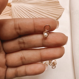 Small heart with pearl inside charm