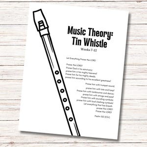 May include: A black and white illustration of a tin whistle with the text "Music Theory: Tin Whistle" and "Weeks 7-12". The page also includes a religious poem. The image is on a wooden surface.