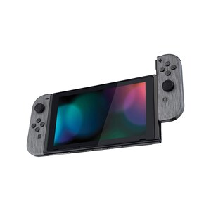 Może przedstawiać: Szara konsola Nintendo Switch z wzorem imitującym drewno. Konsola jest w trybie przenośnym, a na ekranie wyświetlany jest kolorowy abstrakcyjny tło.