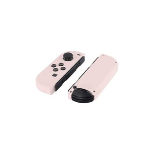 May include: A pair of pink Nintendo Switch Joy-Con controllers with black buttons and a black analog stick. The controllers are separated, showing the left and right sides.