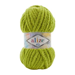 May include: A skein of green yarn labeled "alize Baby Softy Mega".