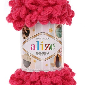 May include: A pink ball of Alize Puffy yarn, a soft and quick yarn for crocheting and knitting. The label reads "Soft & Quick Alize Puffy" and features a star design.