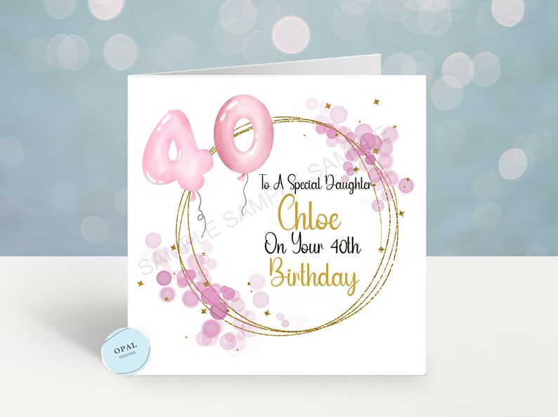 May include: A white card with a pink and gold design. The card says "To a Special Daughter Chloe On Your 40th Birthday".