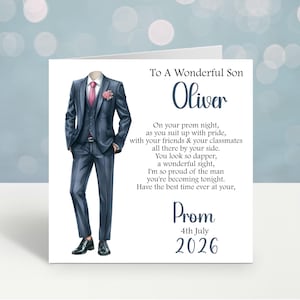 May include: A greeting card featuring a dark blue suit illustration with a pink tie and flower. The card's text reads "To A Wonderful Son Oliver", a prom night poem, and the date "4th July 2026".