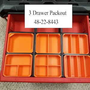 May include: A red toolbox with three drawers. The drawers are open and have orange dividers. The toolbox has a black label that says "3 Drawer Packout 48-22-8443".