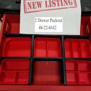 May include: A red two-drawer packout toolbox with black dividers and a white label that says "2 Drawer Packout 48-22-8442".