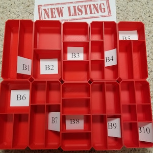 May include: Red plastic storage organizer with ten compartments labeled B1 through B10.