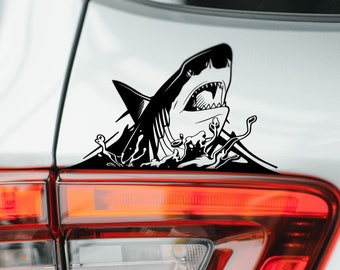 May include: Black and white shark decal sticker with water splash design. The sticker is applied to the back of a silver car.