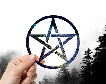 May include: A circular pentagram with a glittery, multicoloured design held in front of a misty forest backdrop. The star is outlined in dark blue and has a five-pointed star shape.