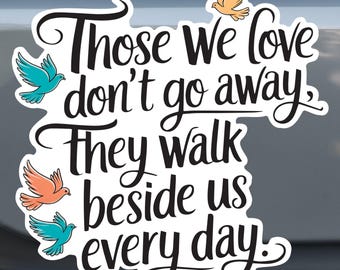 May include: White sticker with black text that reads "Those we love don't go away. They walk beside us every day."  Four colourful birds are flying around the text.