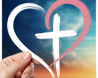 May include: A white cross within a heart shape, outlined in pink, set against a blue and orange sky. The heart is formed by a white brushstroke. The image is held by a hand.