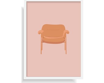 May include: A framed wall art print featuring a centered illustration of an orange armchair with rounded cushions and thin legs, set against a solid light pink background. The artwork is enclosed in a simple white rectangular frame.