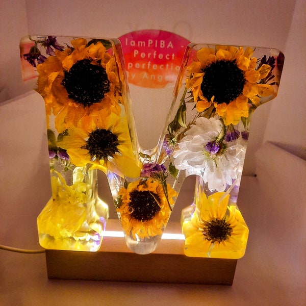 Real Sunflower Resin Letter Block. 6-Inch Real Sunflower Resin Block. Paperweight. Decor. Comes with a LED wood pedestal and USB Wall plug.