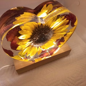 Sunflower, flat bottom heart shaped resin block. Sunflower on a bed of rose petals. USB-corded light. Personalized option. Real Sunflowers!