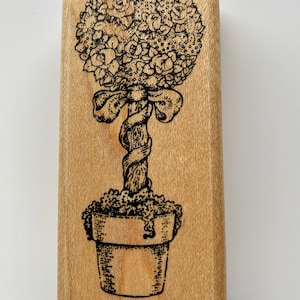 Francobollo, timbro con motivo "Topiaria floreale" di Rubber Stamps of America, 1997