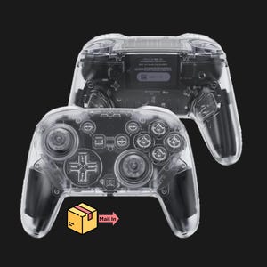 May include: Two transparent game controllers are displayed against a black background. The controllers show internal components. The bottom controller has a yellow box with the words "Mail In" and an arrow pointing to the right.