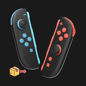 May include: Two black game controllers with colored accents. One controller has blue buttons and trim, the other has orange buttons and trim. The controllers have a joystick and several buttons. The image also includes a graphic that says "Mail In".