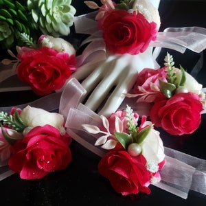 These corsages are part of my wedding corsage collection. Hot pink, pink, pale light pink artificial flowers with faux greenery/pearl accent
