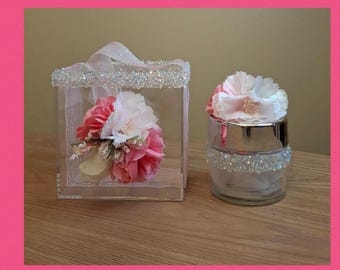 This is a beautiful pink, light pink and off white artificial floral acrylic flower girl basket with matching glass ring bearer holder.