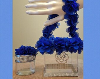This is a beautiful blue ruffle ribbon and silver rose pendant acrylic flower girl basket with matching ring bearer holder.
