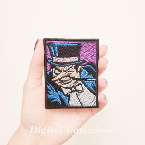 May include: Embroidered patch featuring a cartoon image of a character in a top hat and tuxedo. The patch has a purple background and a black border. The character is holding a cigarette holder. The text "Digital Download" is at the bottom.