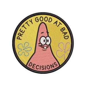 May include: A pink cartoon character with a big smile and two large eyes. The character is surrounded by a yellow circle with the text "Pretty Good At Bad Decisions" in black.