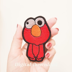 May include: Embroidered patch featuring a red cartoon character with large, light-colored eyes, an orange nose, and a black outline. The patch is in the shape of the character's head and body. The text "Digital Download" is at the bottom.