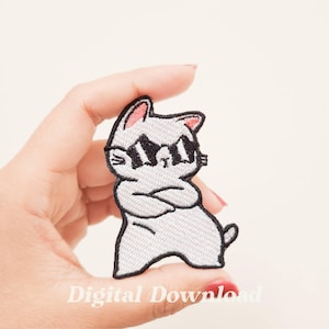 May include: White embroidered iron-on patch of a cat wearing sunglasses and with its arms crossed. The cat is standing with its legs slightly apart.