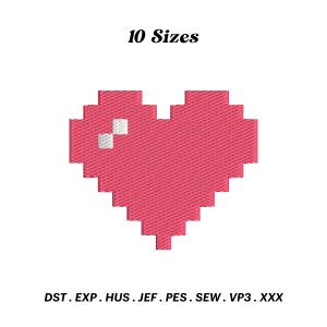 Könnte beinhalten: Pinkfarbenes Pixelherz mit einem weißen Pixeldetail. 10 Größen. DST, EXP, HUS, JEF, PES, SEW, VP3, XXX.