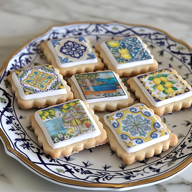 A plate of decorated cookies on a marble countertop.
