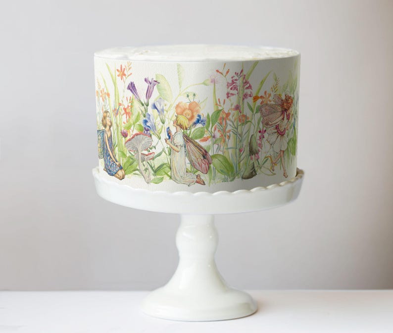 A white cake stand with a decorative floral pattern on it.