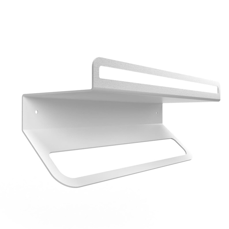 May include: White metal wall-mounted shelf with a towel bar underneath. The shelf has a raised edge on the front and back.