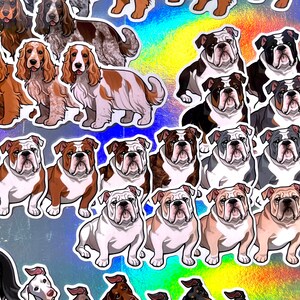 May include: A collection of colorful stickers featuring various dog breeds, including bulldogs and spaniels. The stickers are printed on a holographic background.