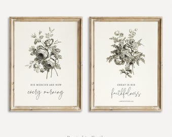 May include: Two framed wall art prints featuring black and white botanical floral illustrations. The left print displays the text 'HIS MERCIES ARE NEW every morning'. The right print displays 'GREAT IS HIS faithfulness LAMENTATIONS 3:23'.
