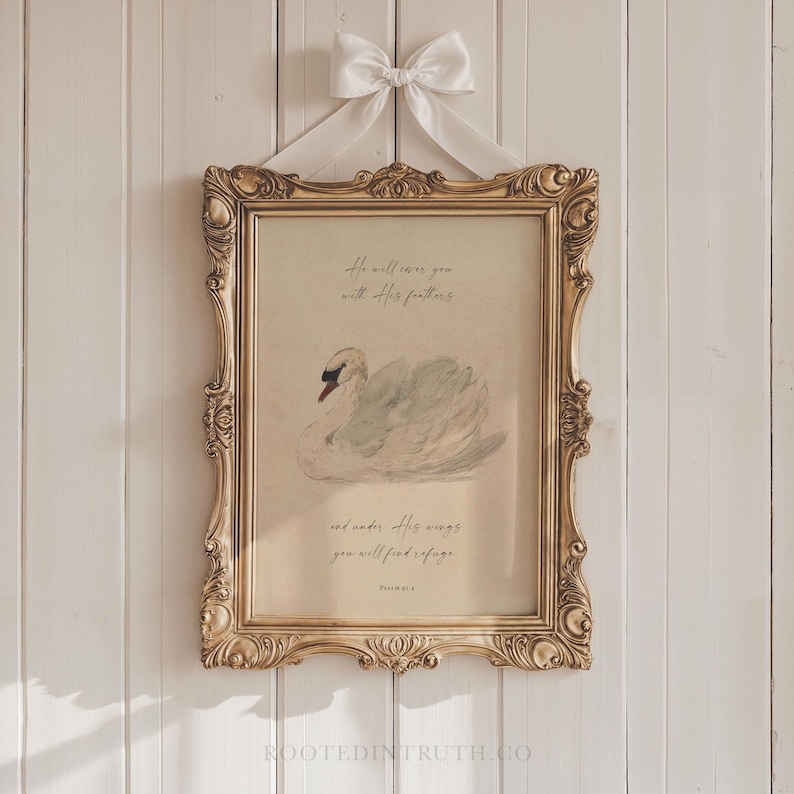 a picture of a swan hanging on a wall