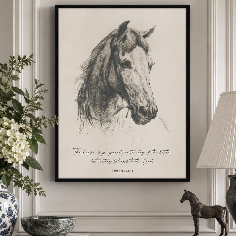 May include: A framed wall art print featuring a detailed charcoal-style sketch of a horse head facing right. Below the illustration, the text reads: The horse is prepared for the day of the battle, but victory belongs to the Lord. Proverbs 21:31.